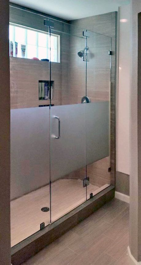 A bathroom with a glass shower door in Austin