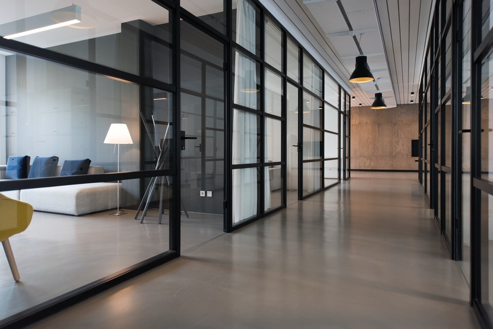 An office hallway with glass panel doors